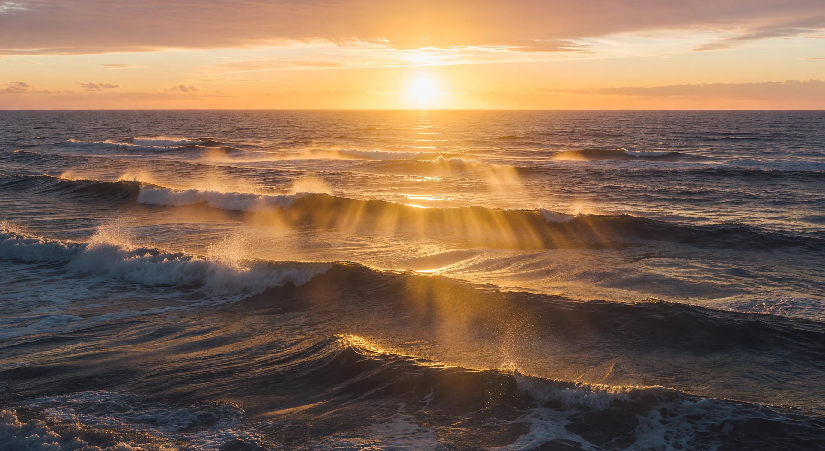Sunrise over waves